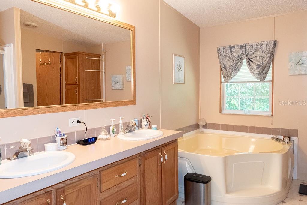 His & Hers sinks with garden tub Walkin shower too!