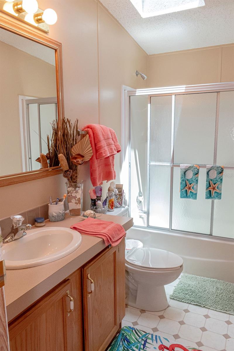 Front bathroom with tub & shower