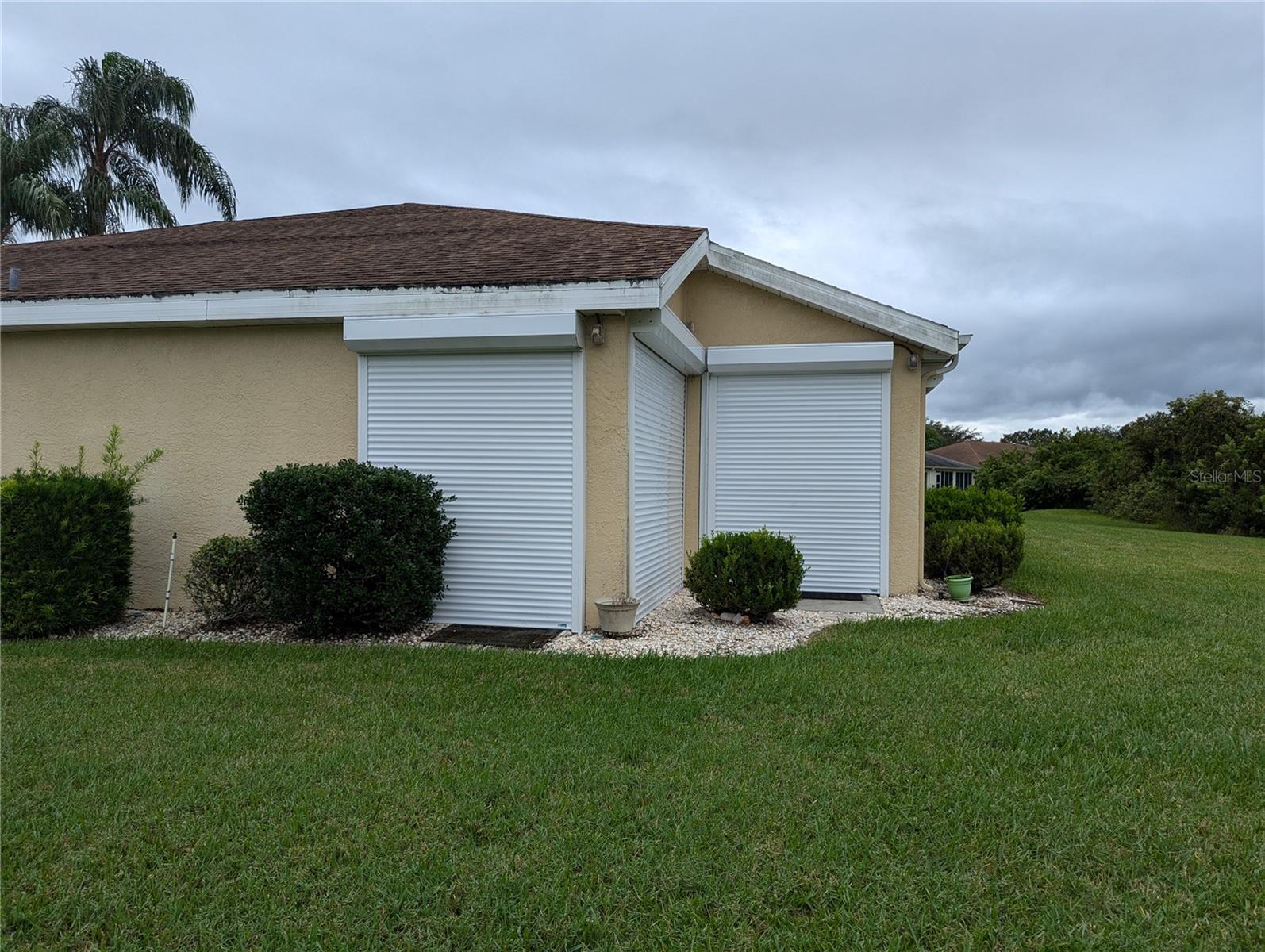 Auto Up/Down Hurricane Shutters. All openings covered.