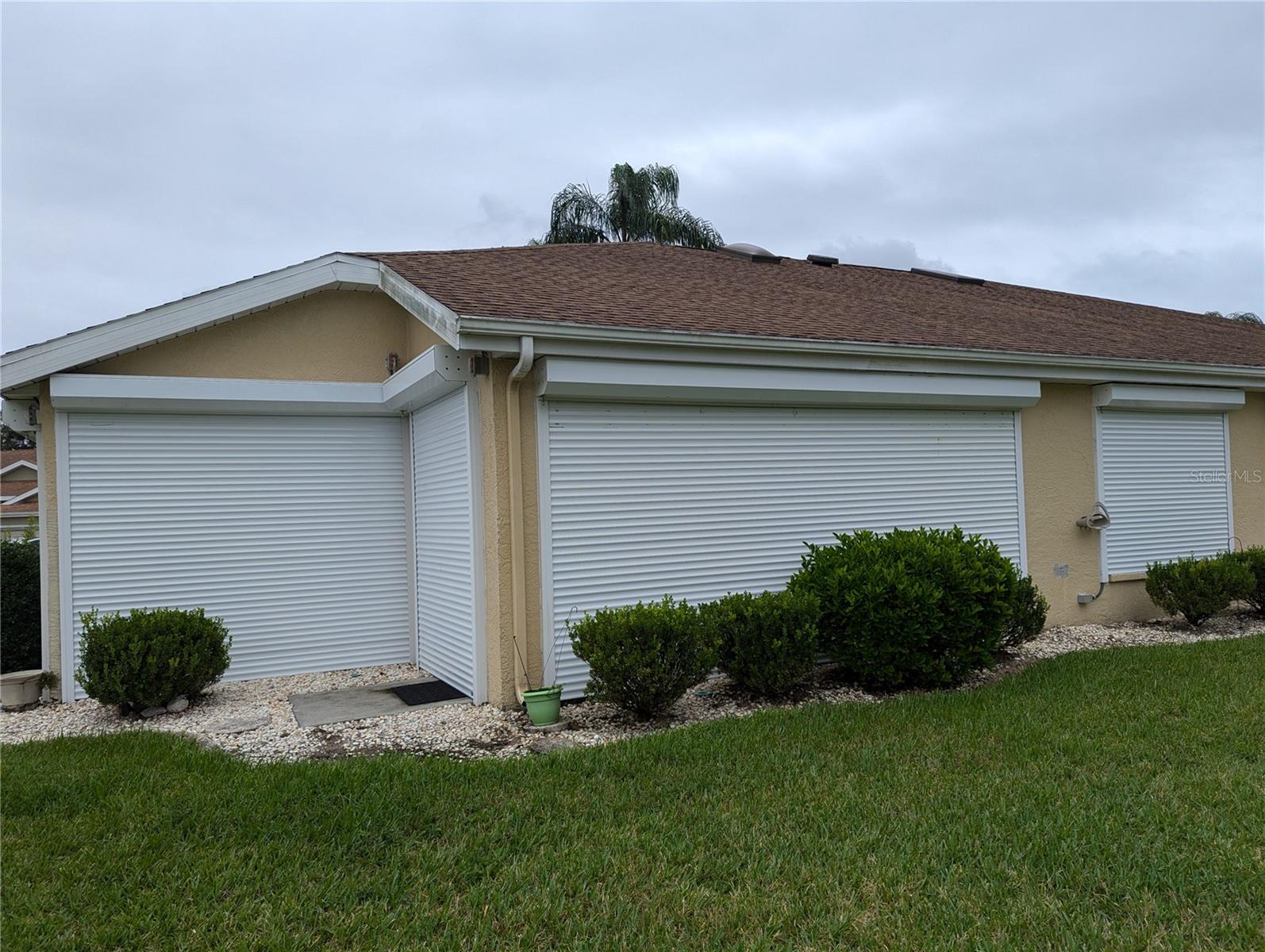 Auto Up/Down Hurricane Shutters. All openings covered.