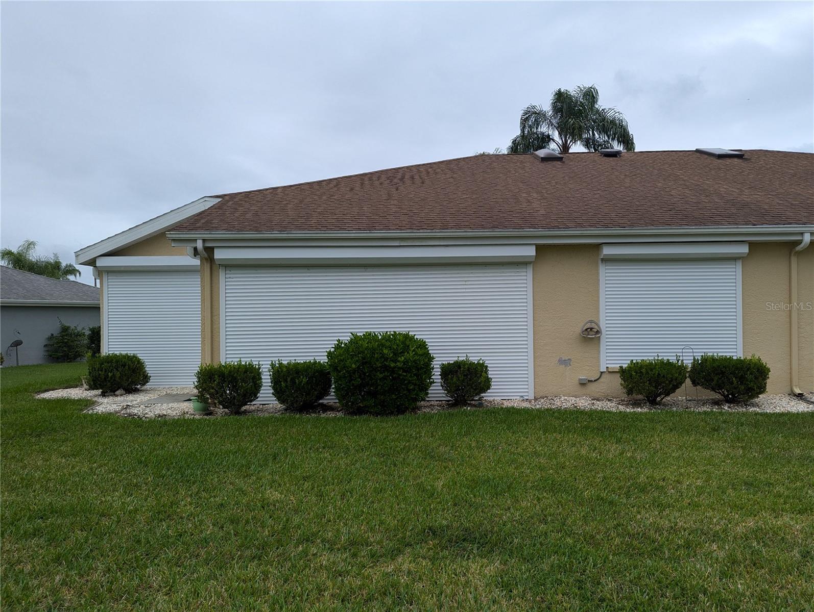 Auto Up/Down Hurricane Shutters. All openings covered.