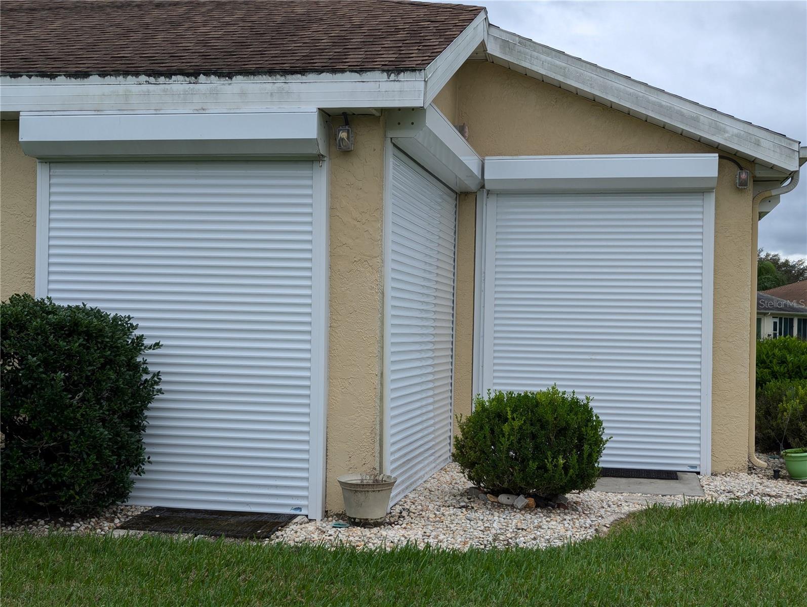 Auto Up/Down Hurricane Shutters. All openings covered.