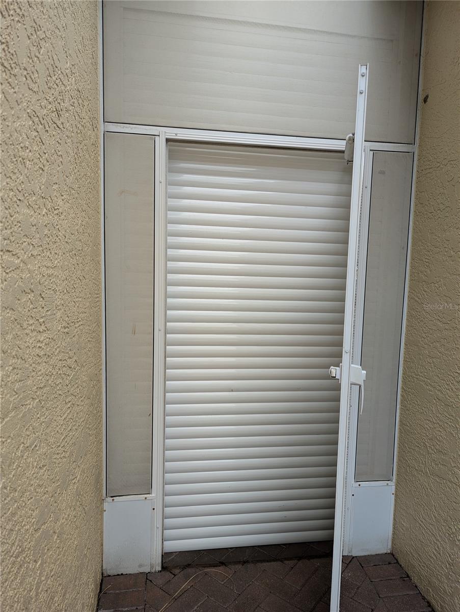 Auto Up/Down Hurricane Shutters. All openings covered.