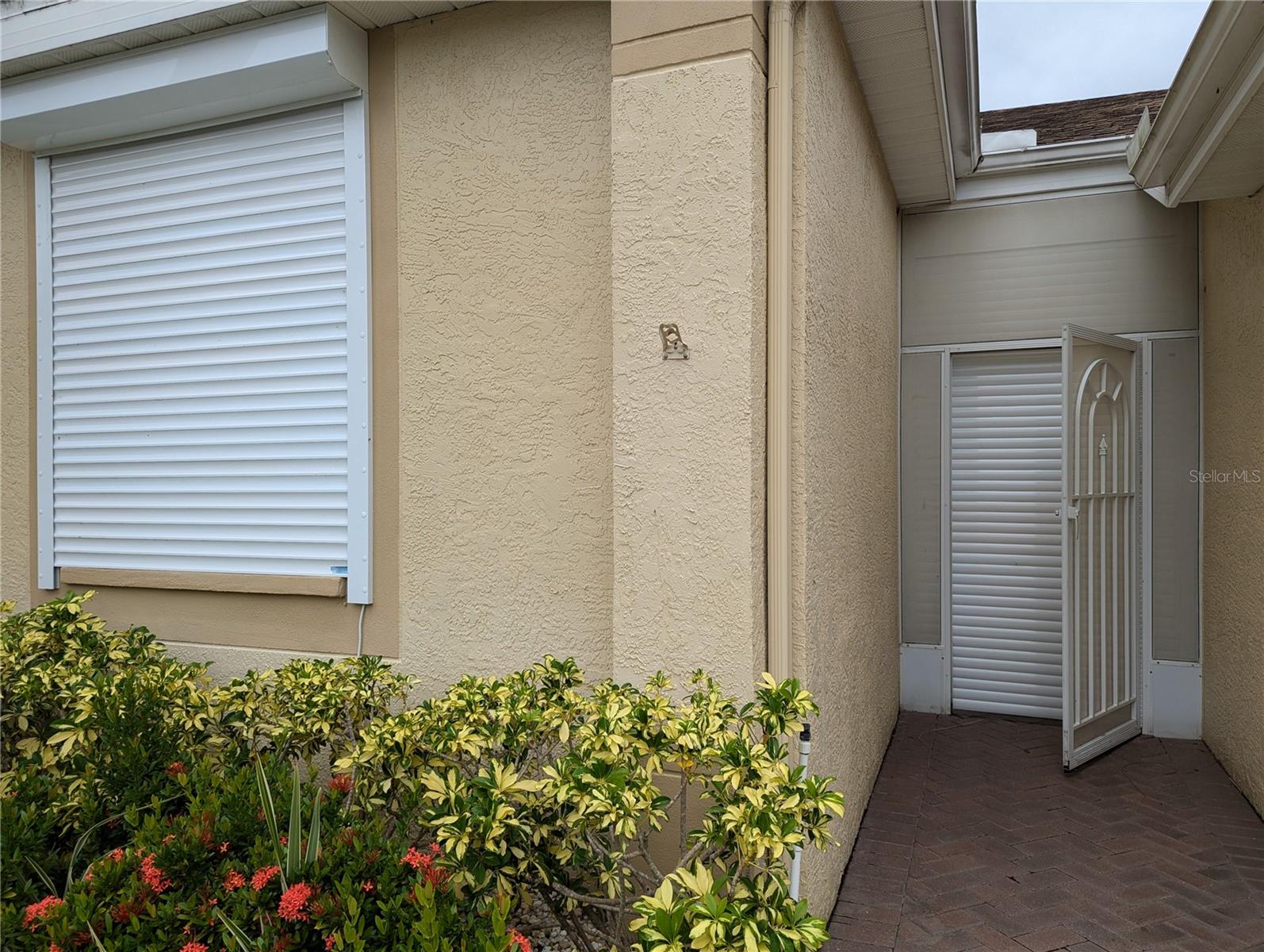 Auto Up/Down Hurricane Shutters. All openings covered.