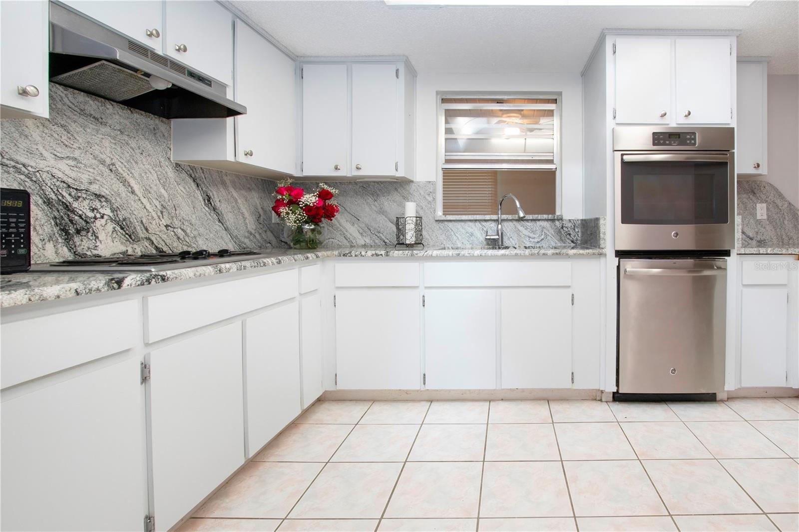 cook top stove with new stainless oven and dishwasher