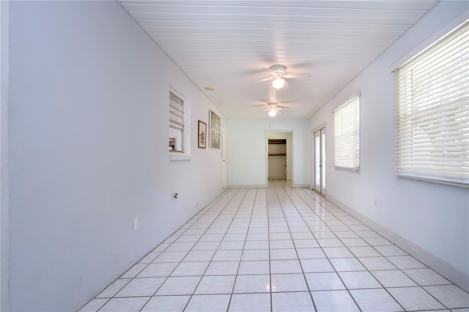 enclosed lanai with view of large storage area