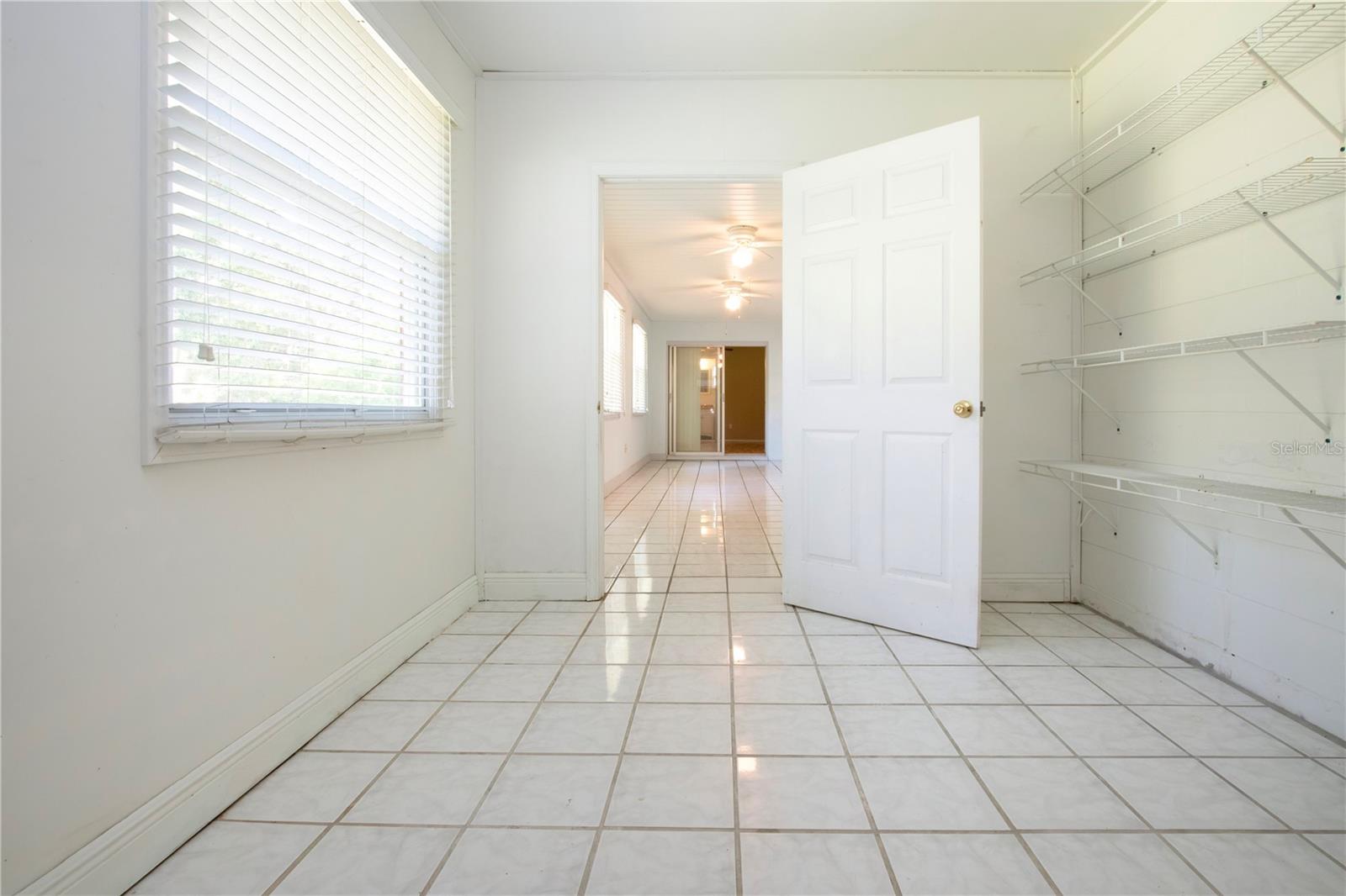 large storage area with view to the enclosed lanai