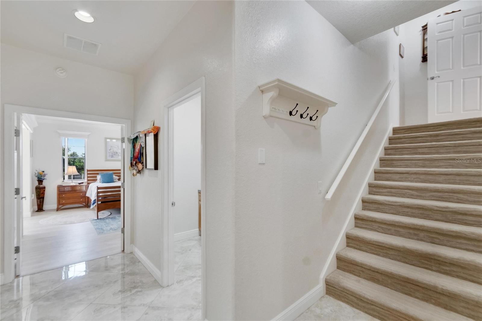 From Left to Right: Primary (Master) Bedroom - Laundry Room - Stairway to Bedroom #4