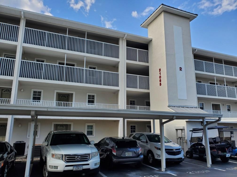 Parking space for condo is to the right of the elevator