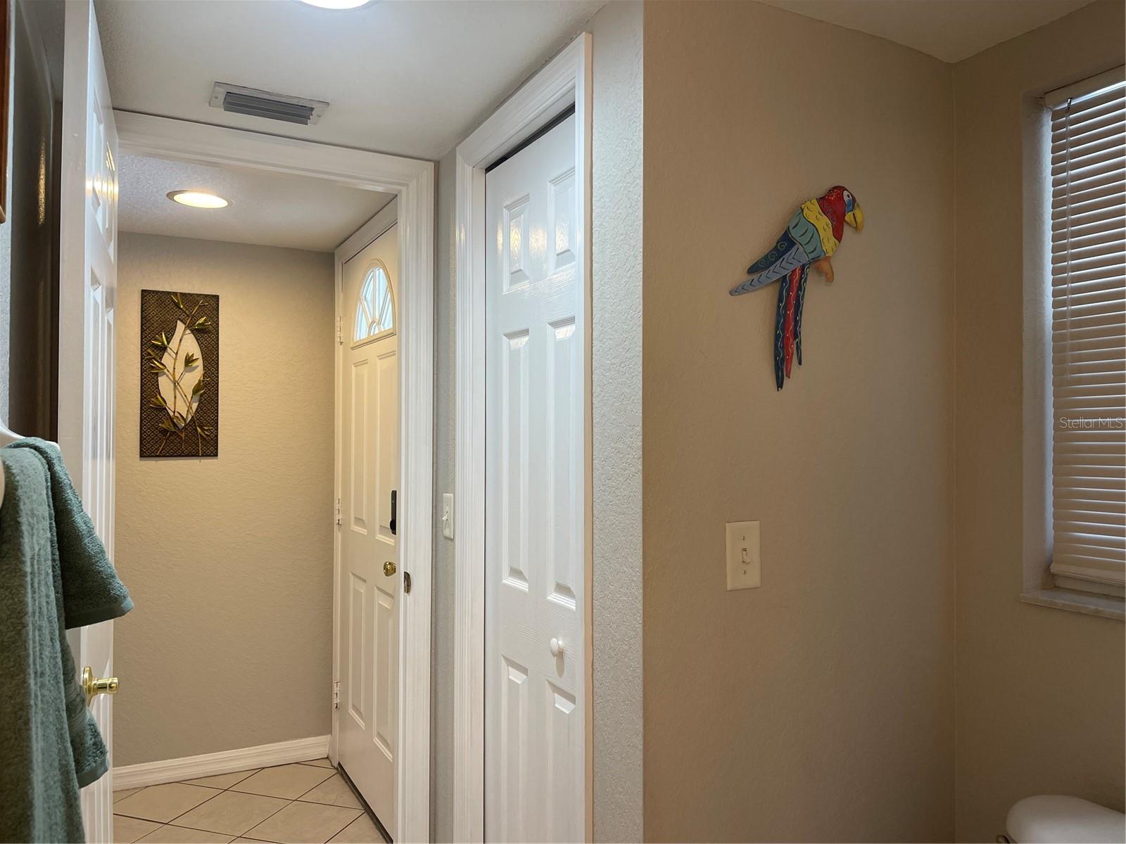 Linen closet in primary bathroom is on the right.