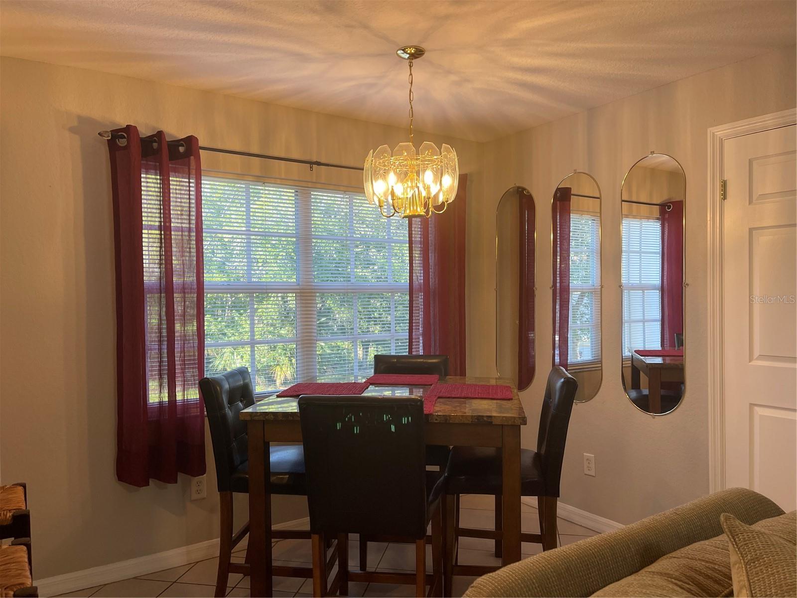 Mirrored accent in the dining room reflect light