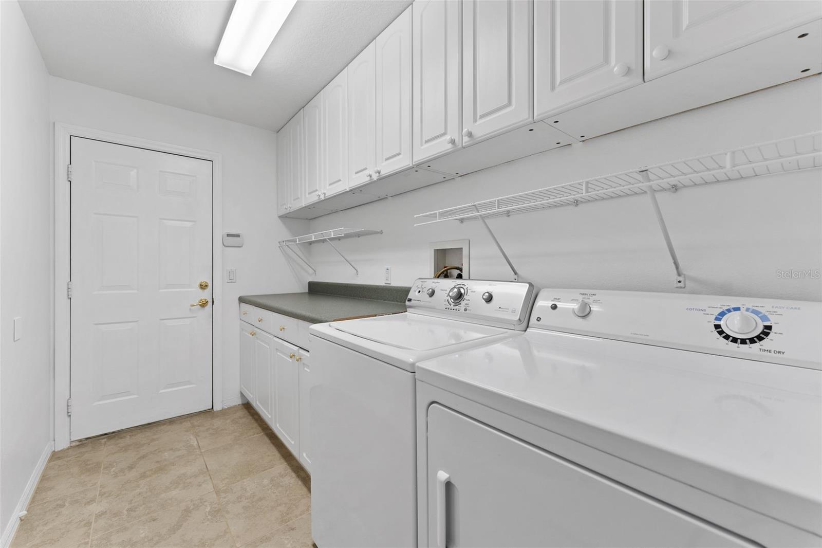 Nice sized laundry room With Folding Table!