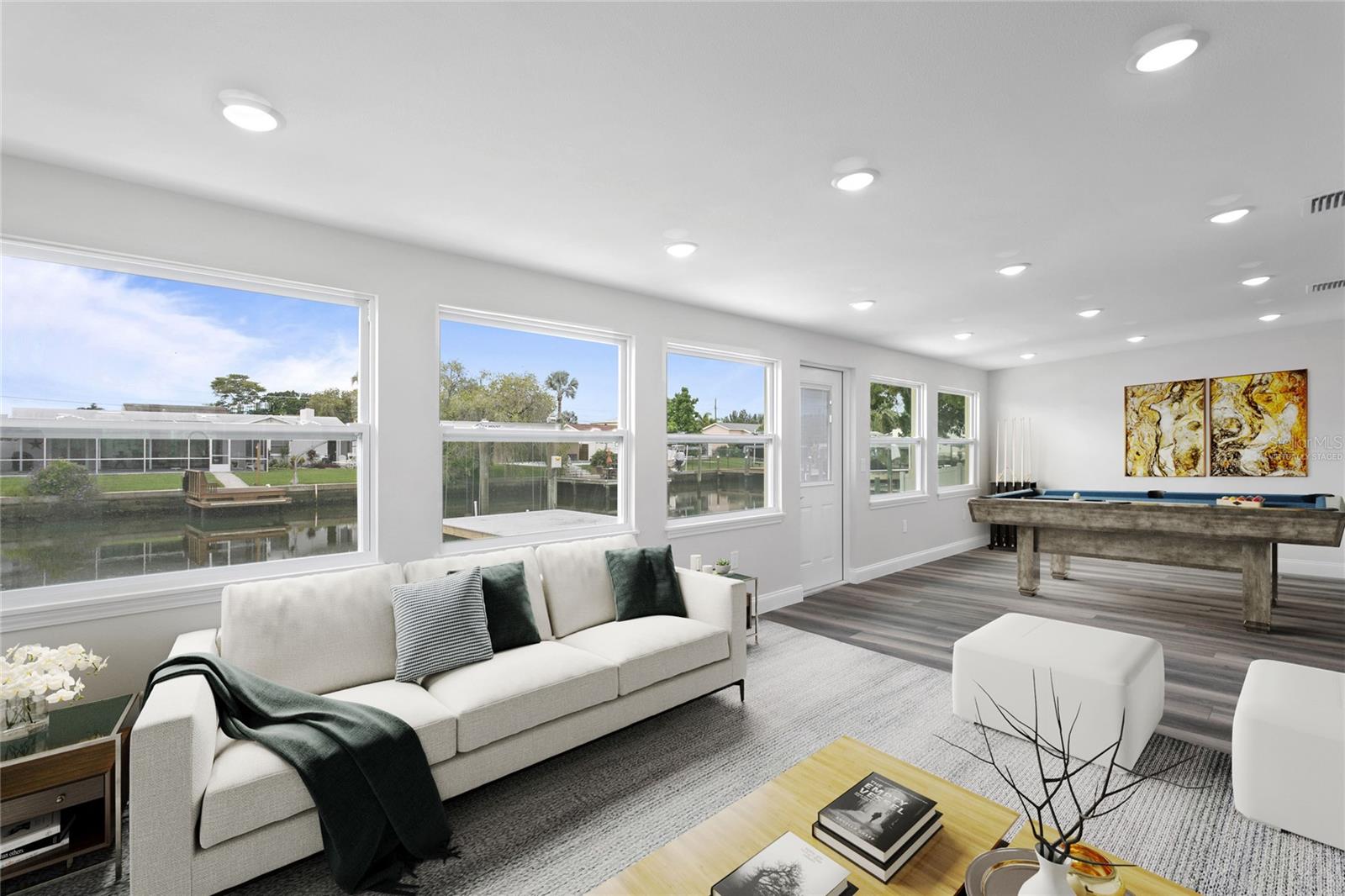 Virtually staged Florida room with pool table and sitting area