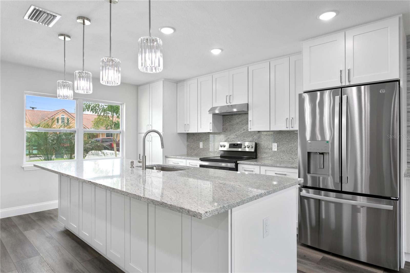 Gorgeous granite countertops and stainless steel GE appliances