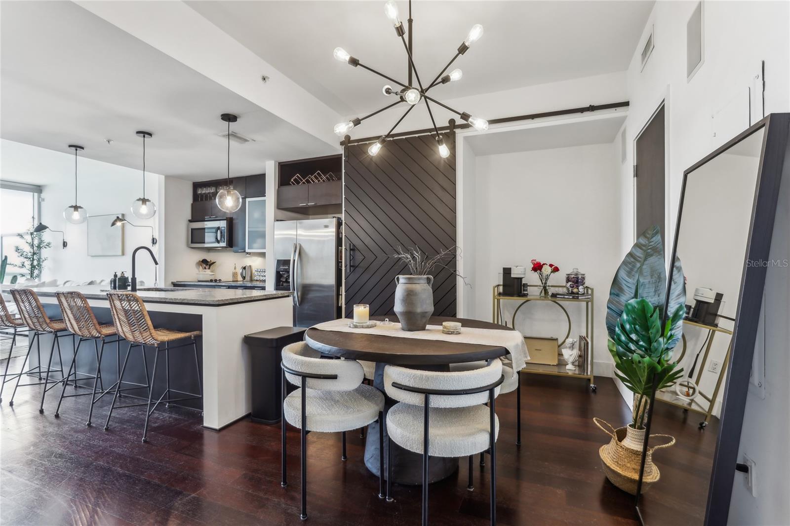 Kitchen and dining room with door to laundry room