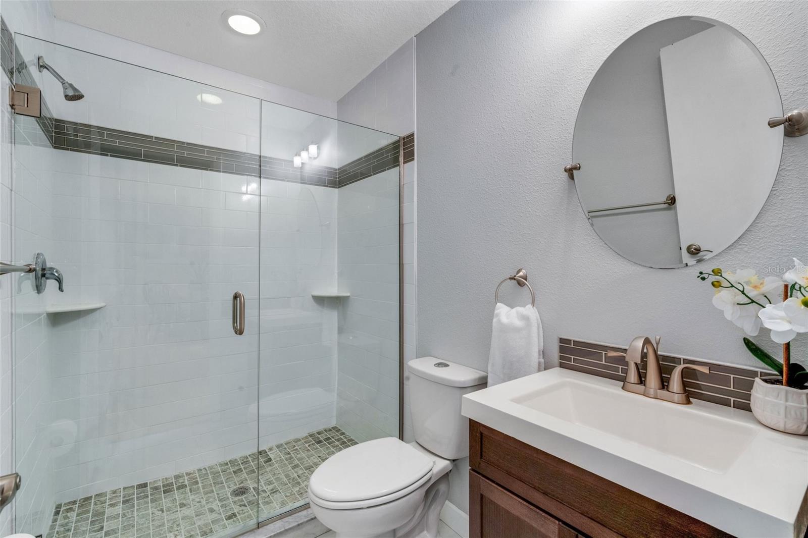 Beautifully remodeled hall bath with step-in shower, newer vanity & commode~