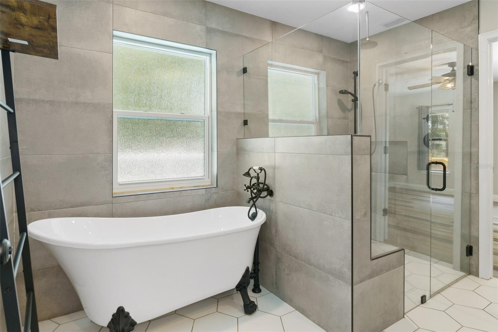 Your choice...take a soak in the tub or enjoy shower with bench