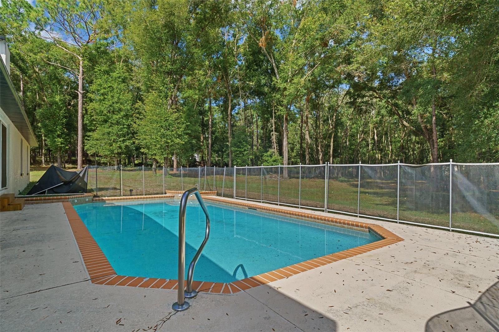 Pool with child safety fence.