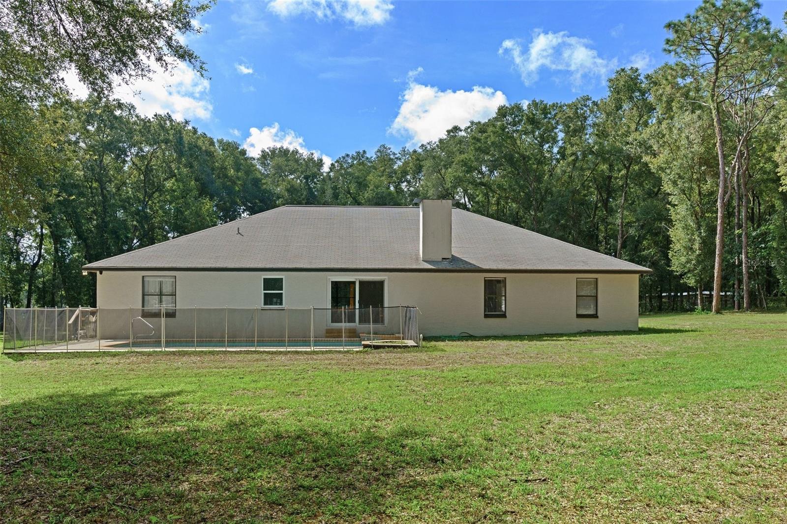 Plenty of room to build extra deck space around pool or add paver patio.