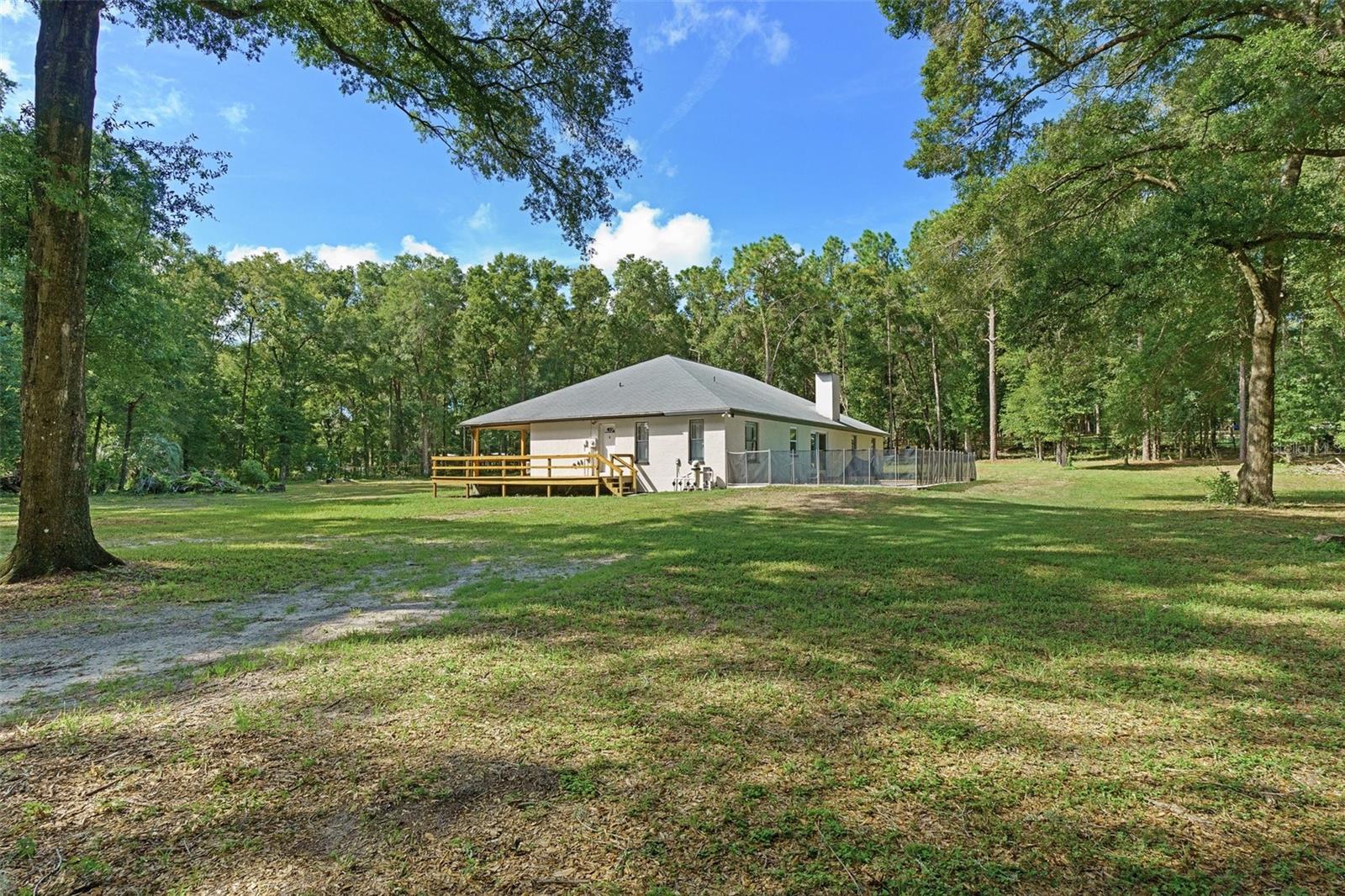 Trees line the borders of the property offering privacy and a country-like feeling.