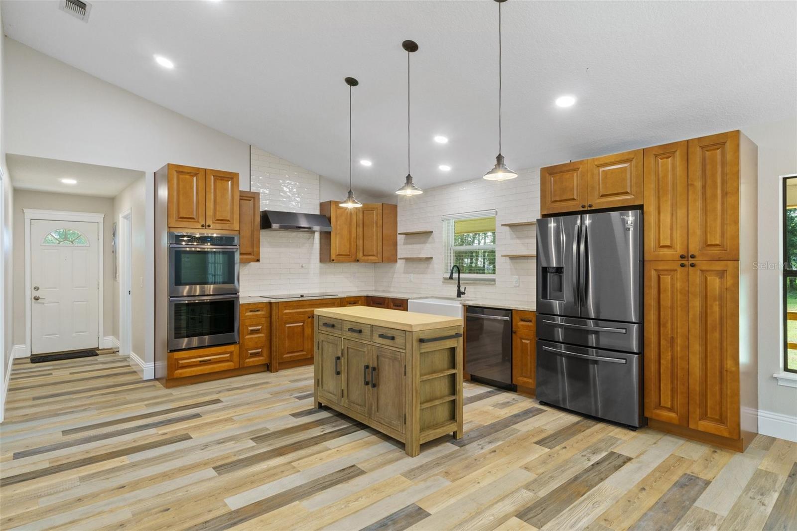 Spacious, eat-in kitchen with portable island.