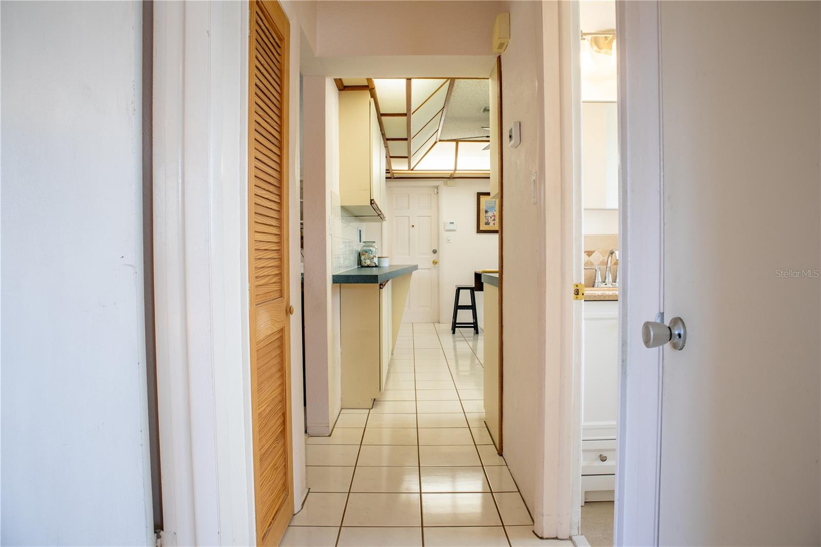 Hallway from the bedrooms to the bedrooms and bathroom.