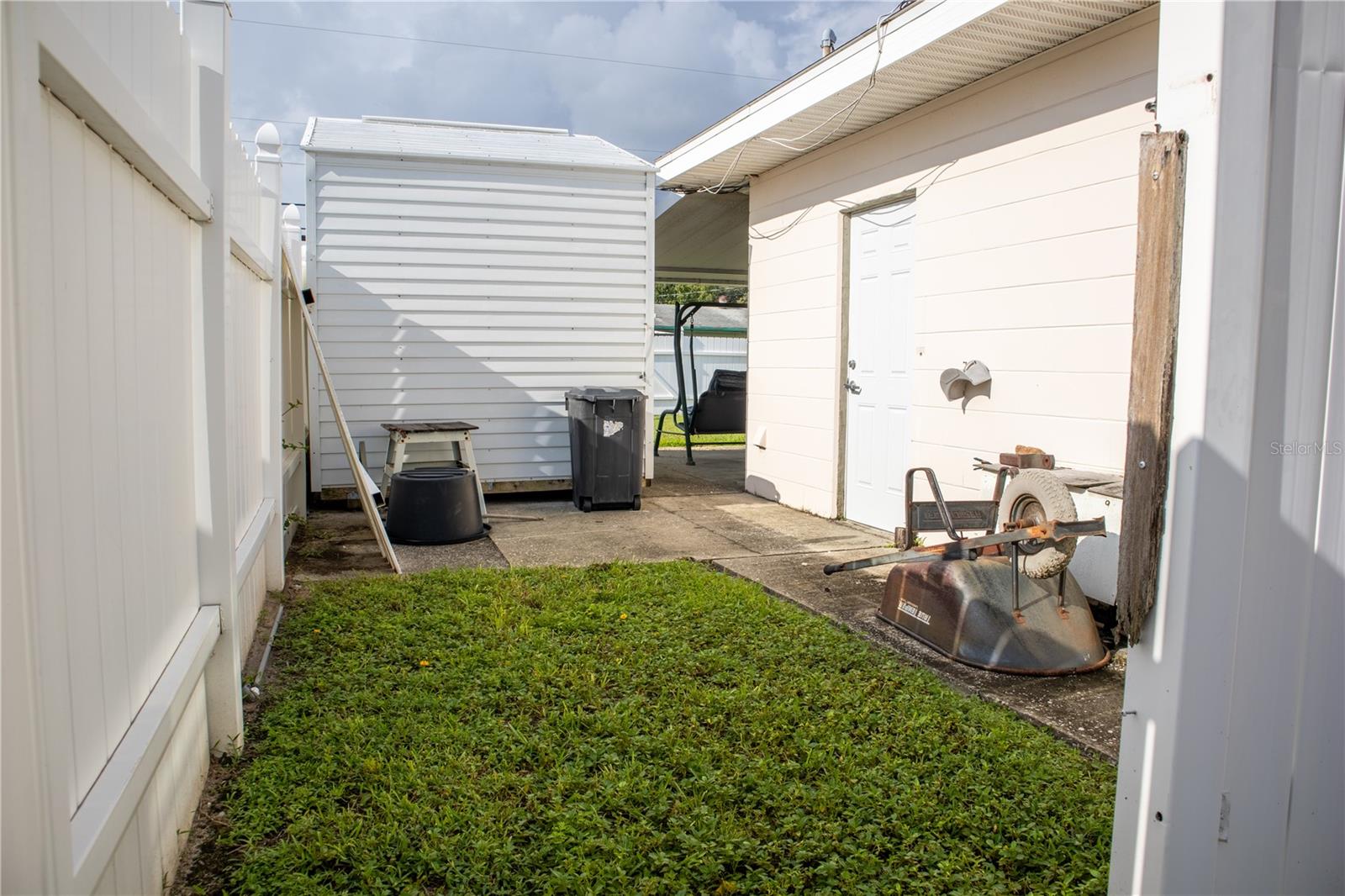 West side of backyard with the side view of Shed #2.