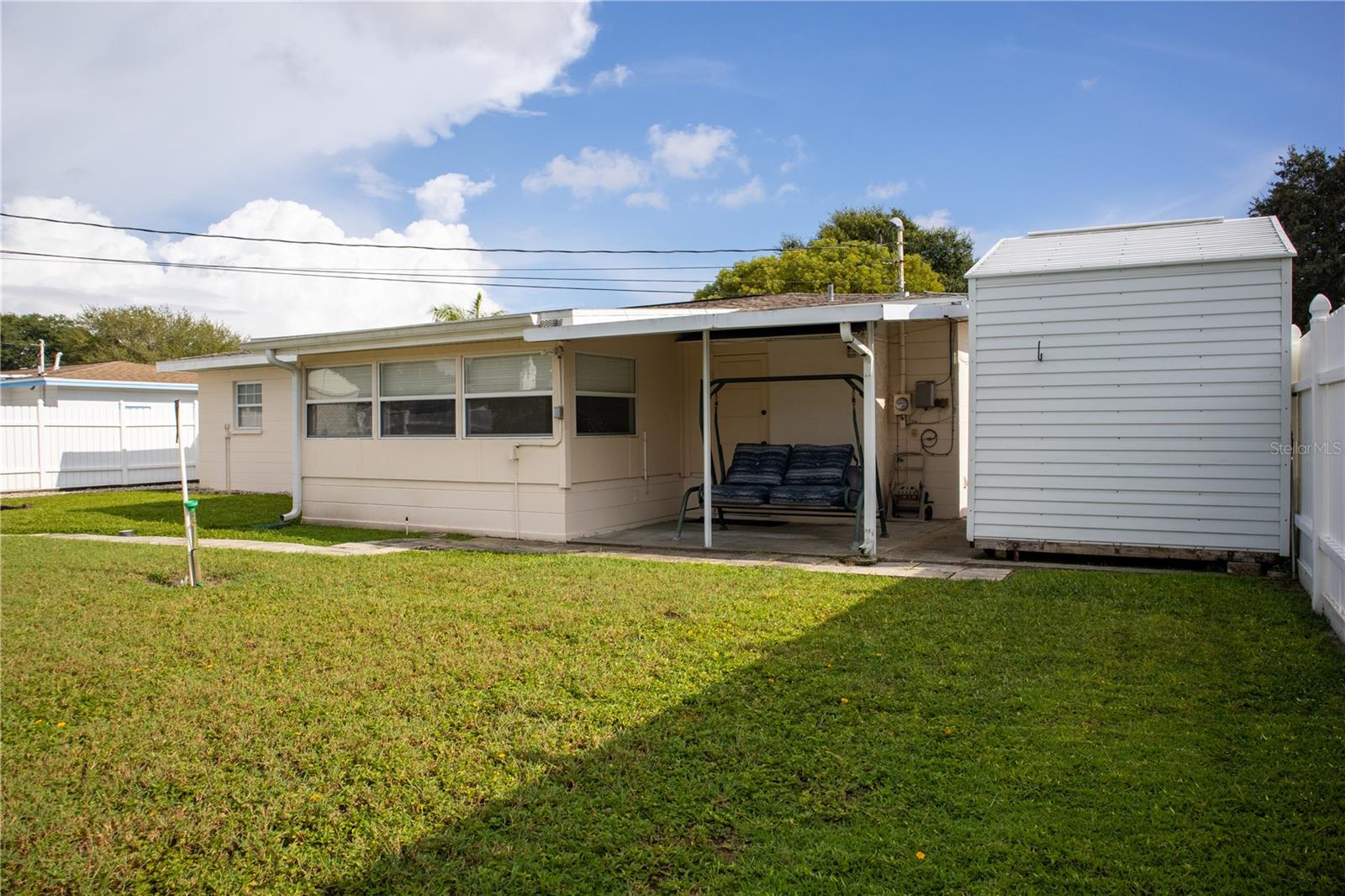 Back of the home, with side view of shed #2.