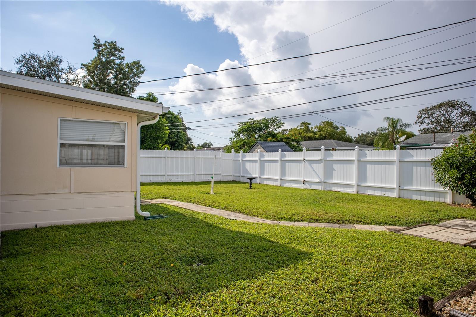 Back of the home, with side view of shed #2.