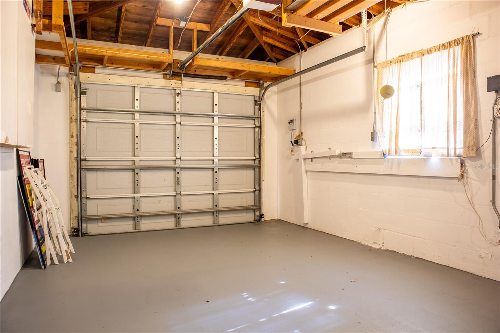 Garage with electric door opener.