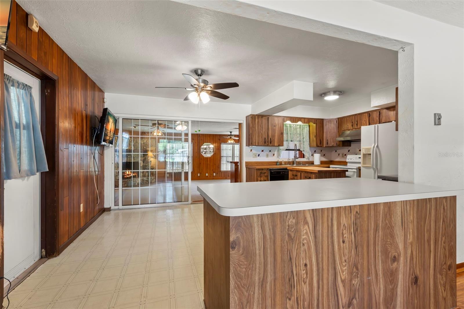 Kitchen with view into Family Room