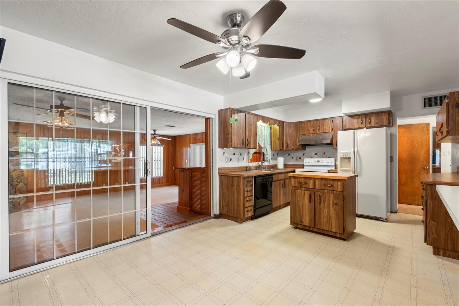 Dining and Kitchen with view into Family Room