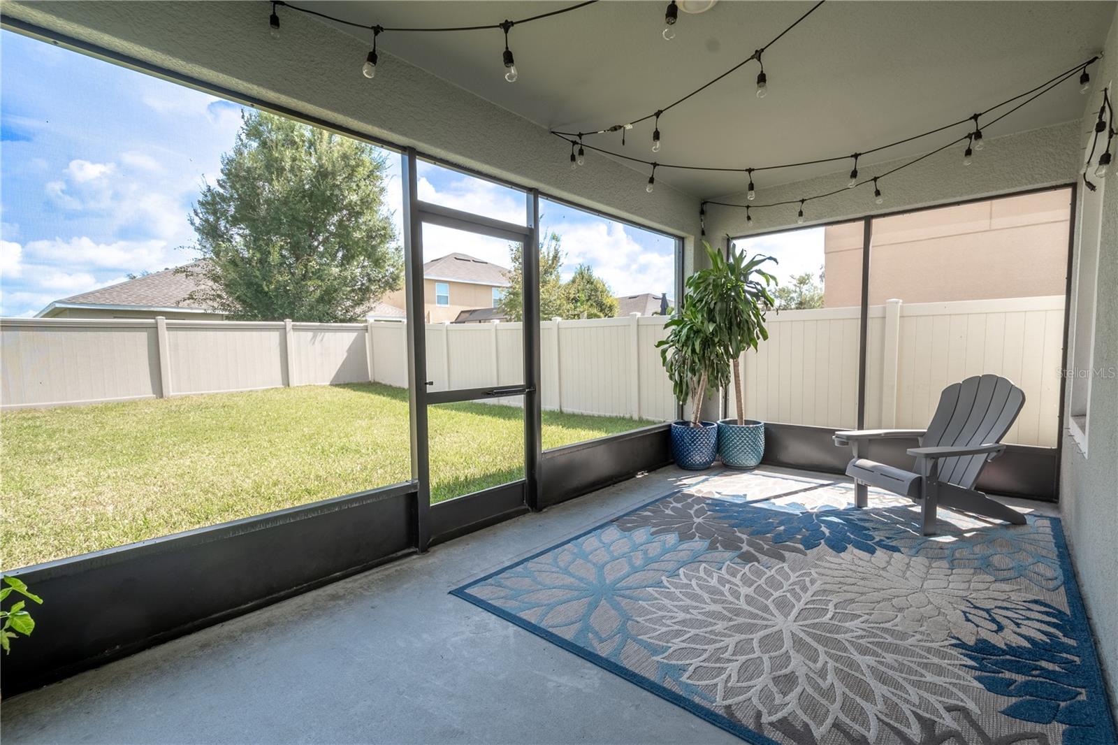 The vinyl, fenced in backyard provides privacy.