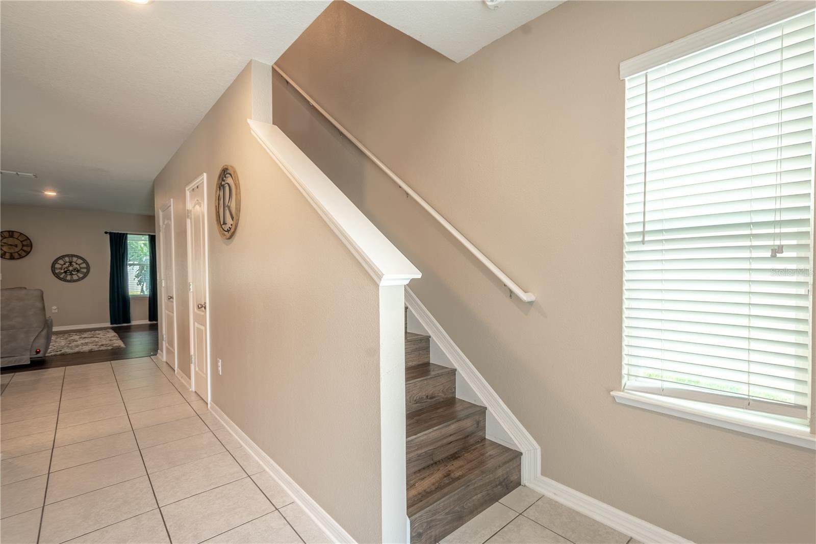 Enter through the spacious foyer with ceramic tile flooring and convenient coat closet.