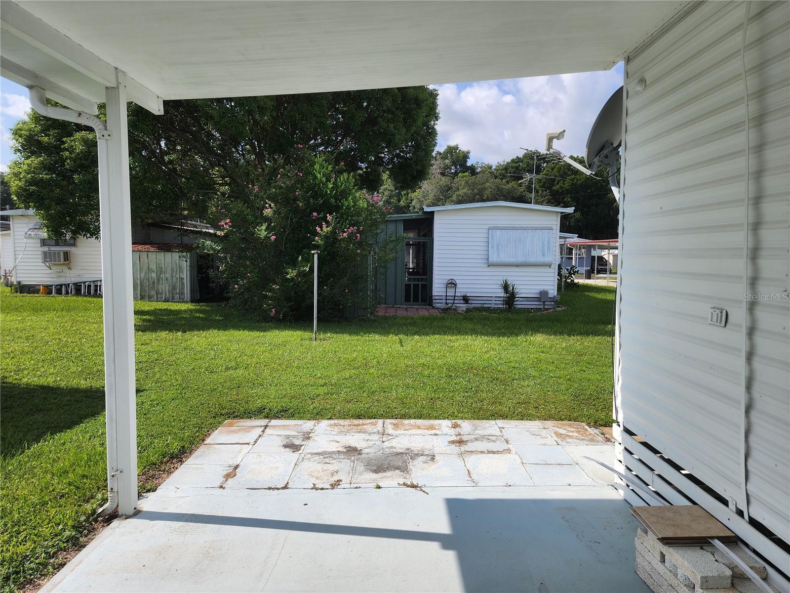 Covered back porch looking towards back yard.