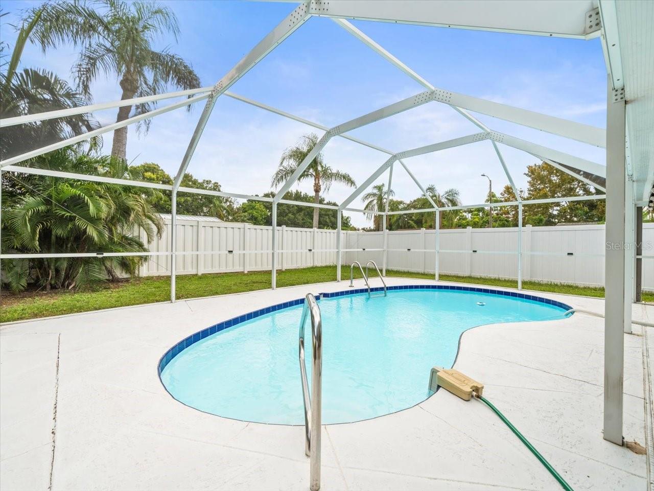 Pool with beautiful surround screen and vinyl fencing