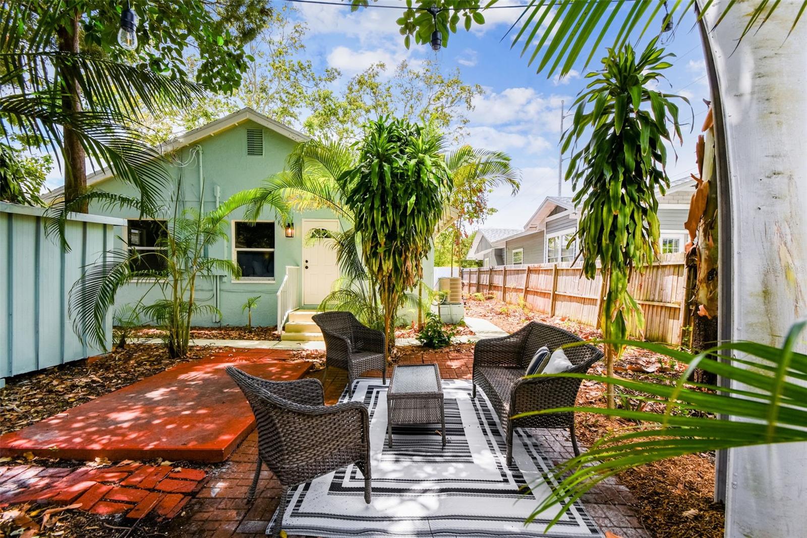 Big backyard with a patio and shed