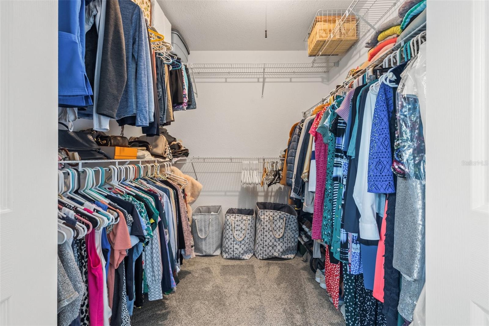 1 of 2 primary walk-in closets