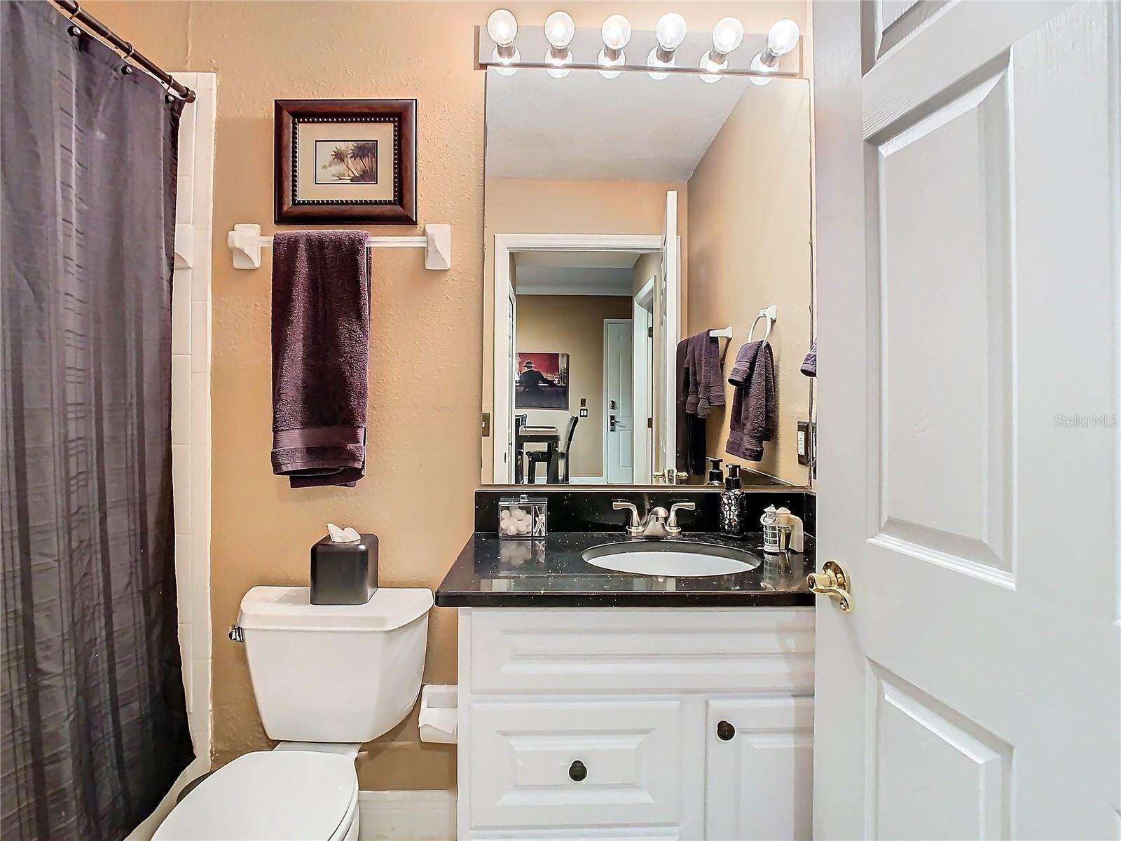 Guest bathroom with new cabinet, counter top and hardware.