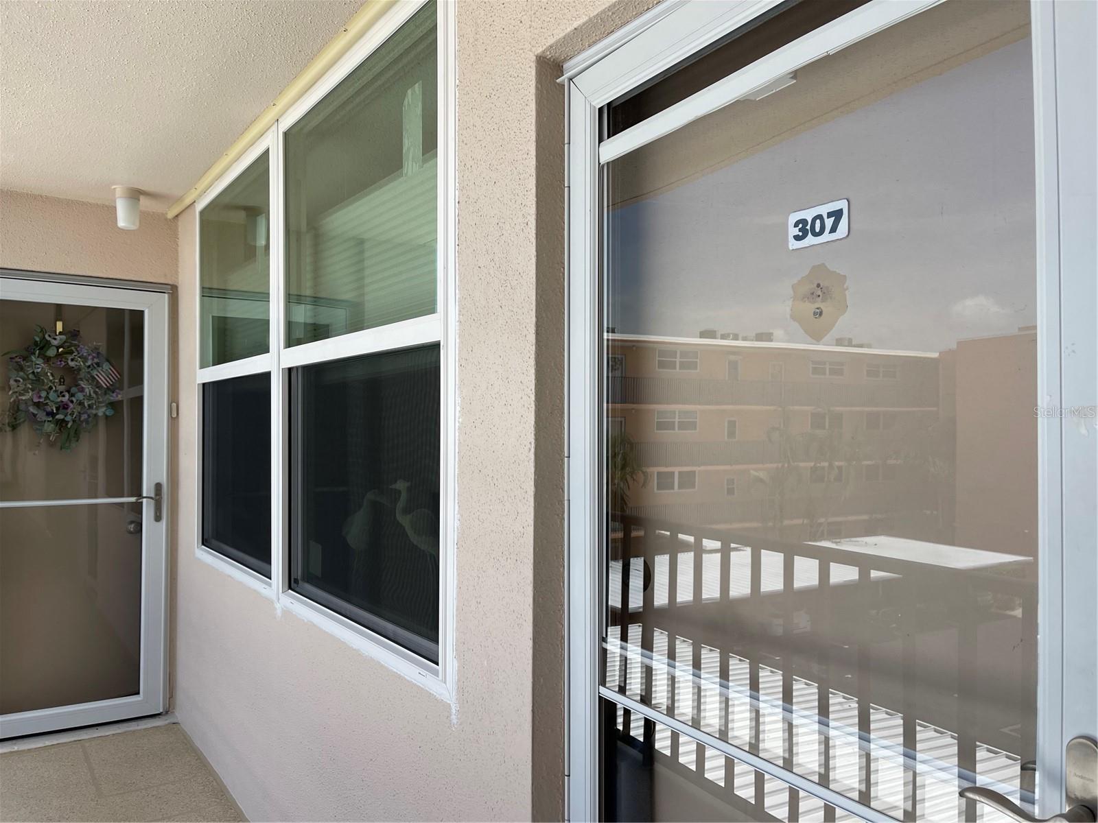 Glass door allows extra sunshine at front entrance