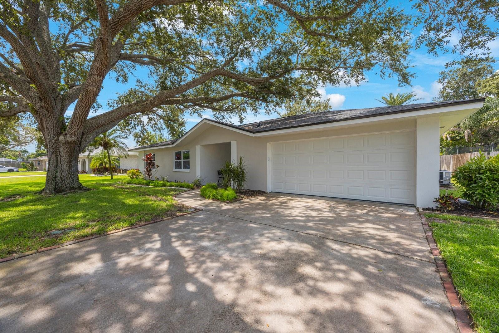 New paint and landscaping and impact garage door too!