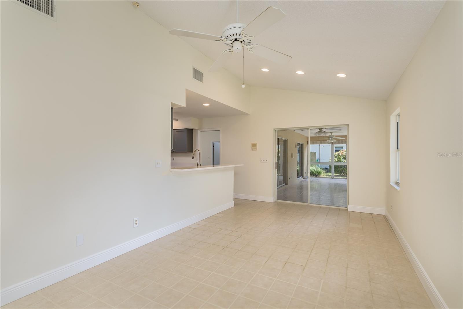 Family room from bookshelves through to Florida room