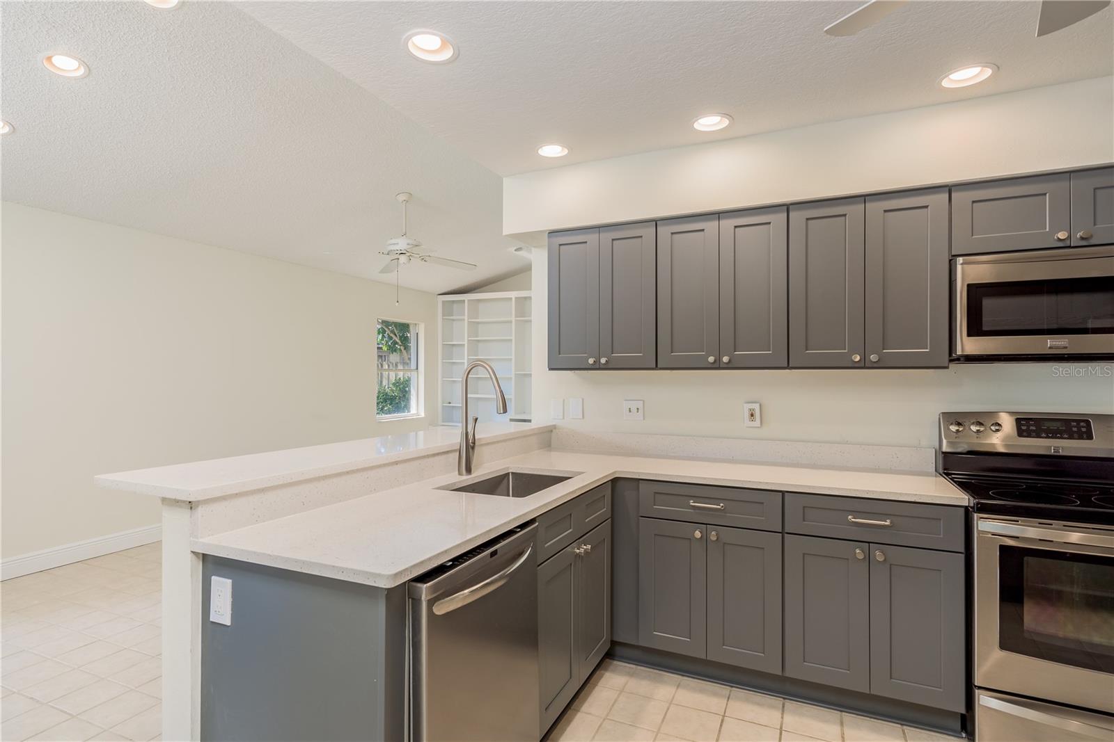 Kitchen breakfast bar into Family room