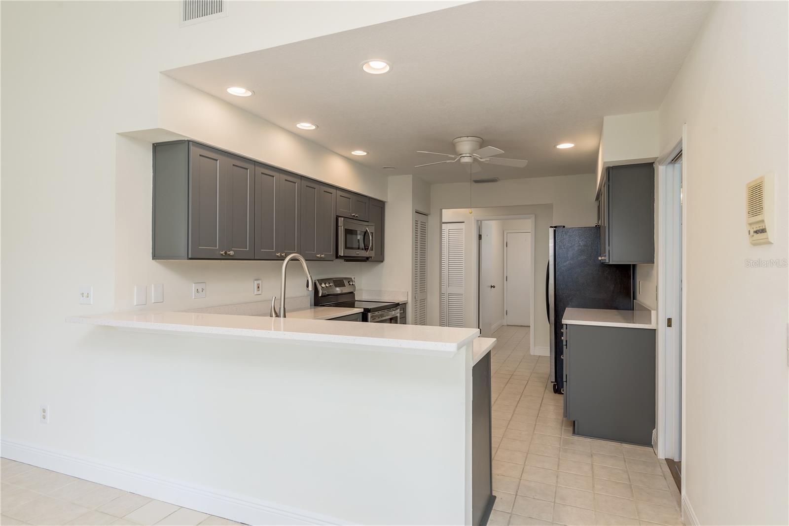 Breakfast bar into kitchen from Family room