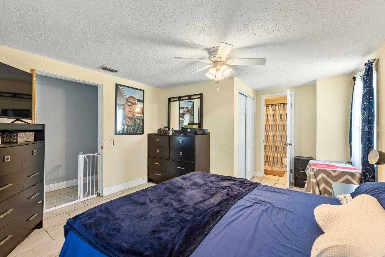 Owners suite featuring a walk-in closet, and ensuite bathroom with a walk-in shower.