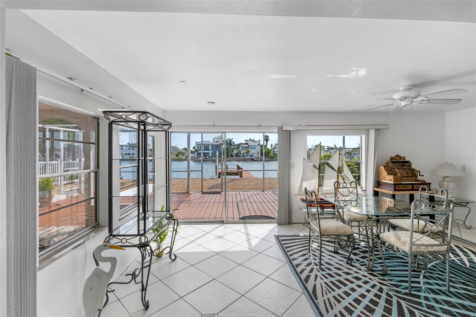 Dining area has views of the water and sliders to the lanai.