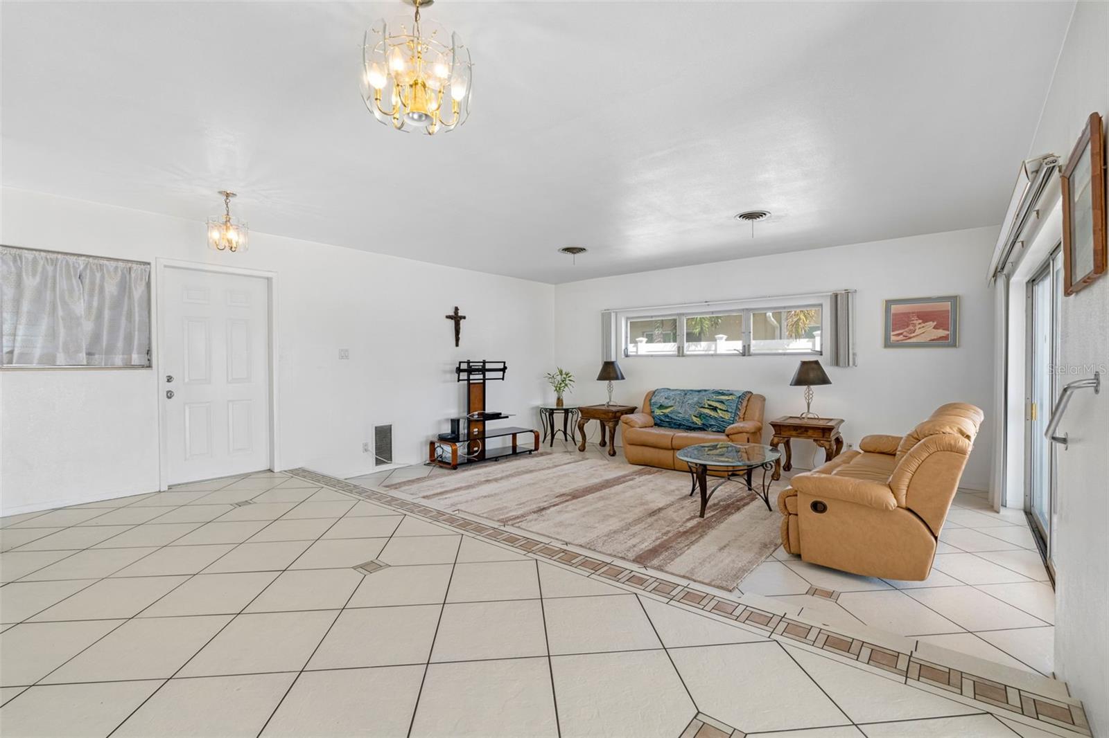 Living area connects to the kitchen.