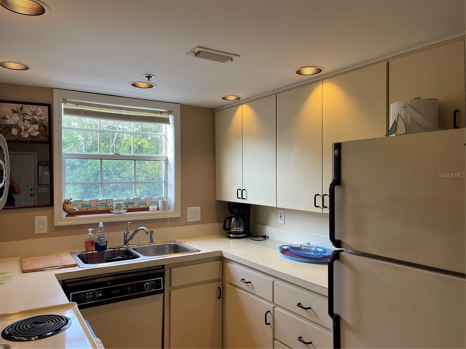 Kitchen has been set up with pots, pans, utenils, coffee maker, plates that will stay with the condo.