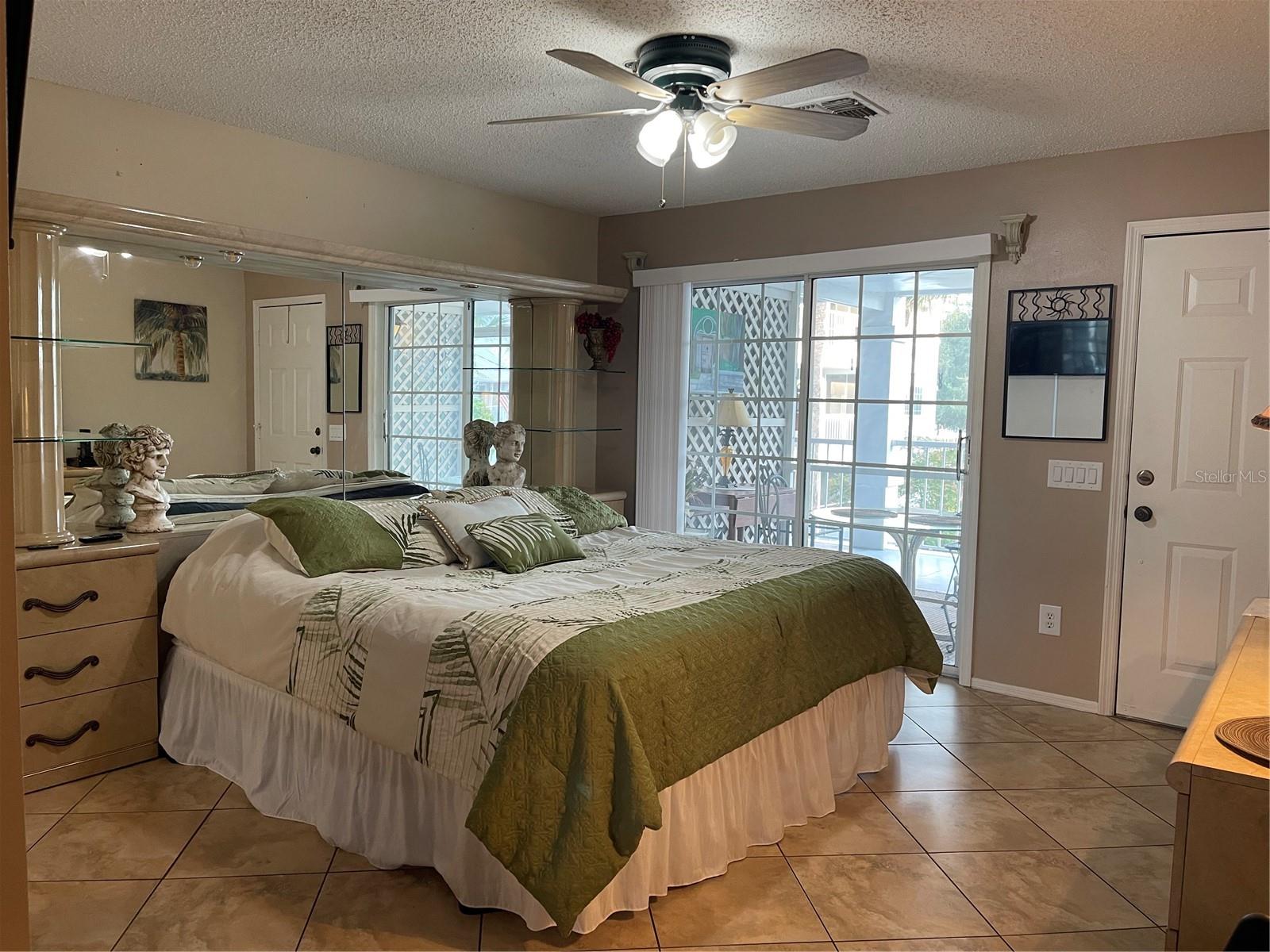 Ceramic tile flooring throughout studio. Blinds provide privacy.