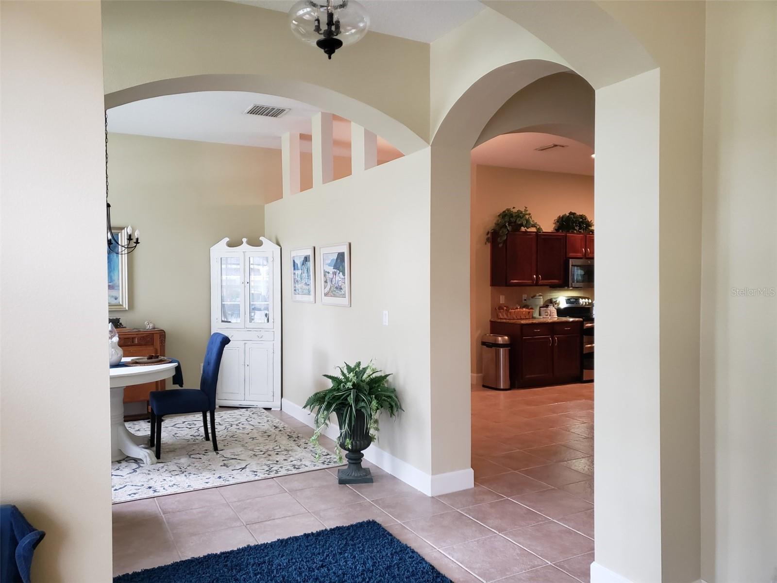 Glimpse of 1st of 2 Flex Spaces (now being used as a Dining Room) from Entry Foyer